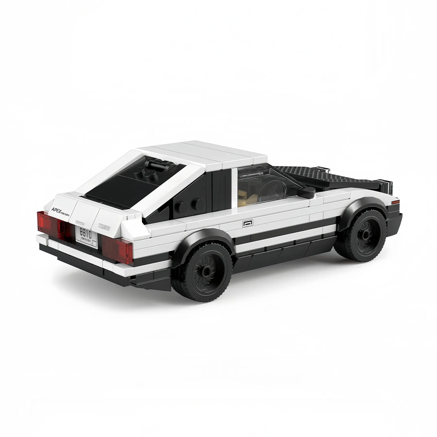 Rear view of the Toyota AE86 Trueno brick model car showing the red taillights, license plate, and black hatchback spoiler.