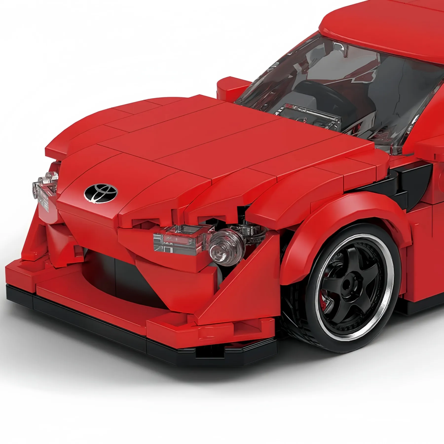 Close-up detailed view of the aggressive front grille and sports headlights on the Toyota GT86 brick car.