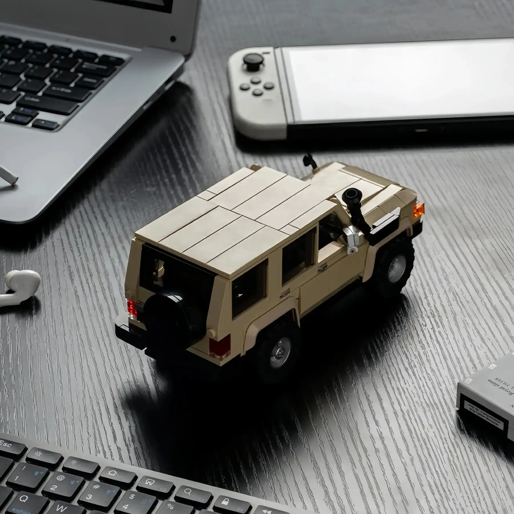Rear view of Toyota Land Cruiser LC78 brick toy car on a wooden table.